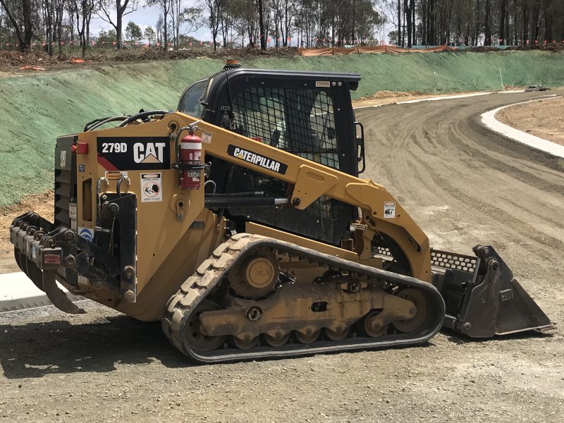 Posi Track Loader spreading gravel